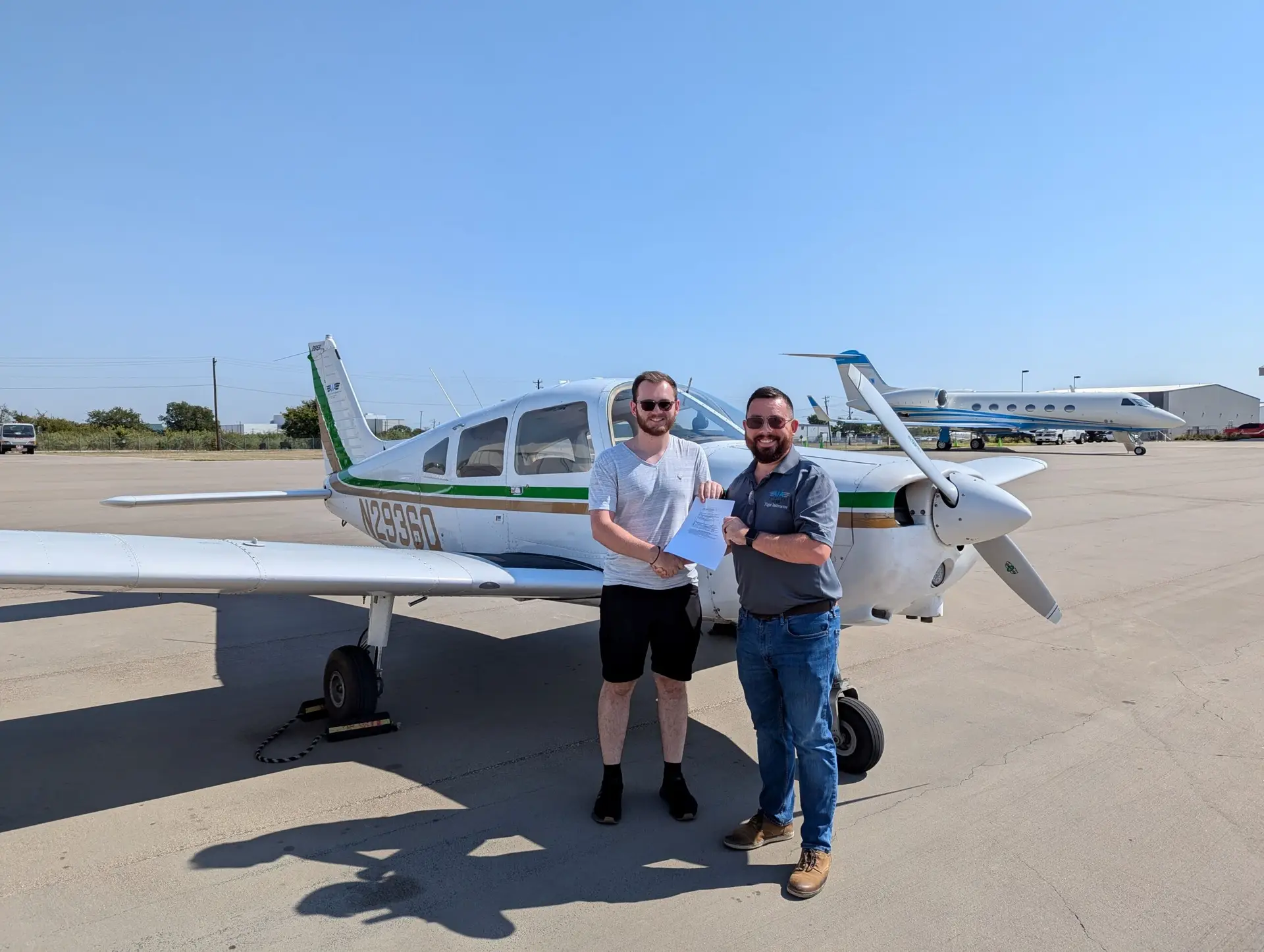 Private pilot certificate earned beside a small aircraft